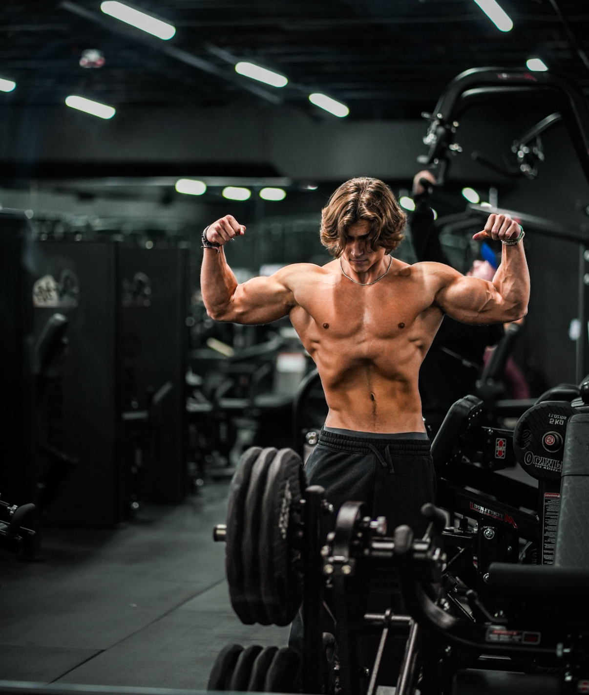 Ryan Shaw — double biceps flex in the gym mirror